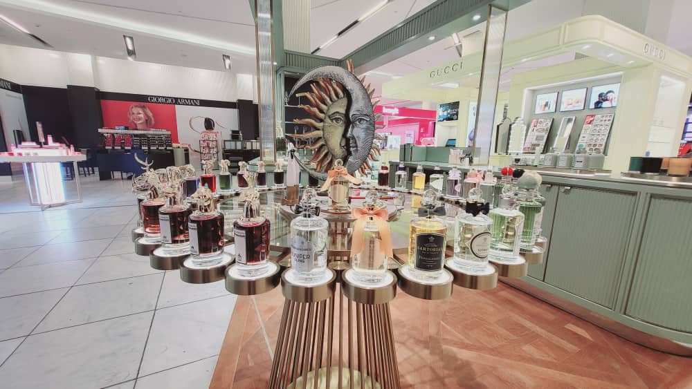 Penhaligon’s fragrance display joinery with green finishes and brass detailing