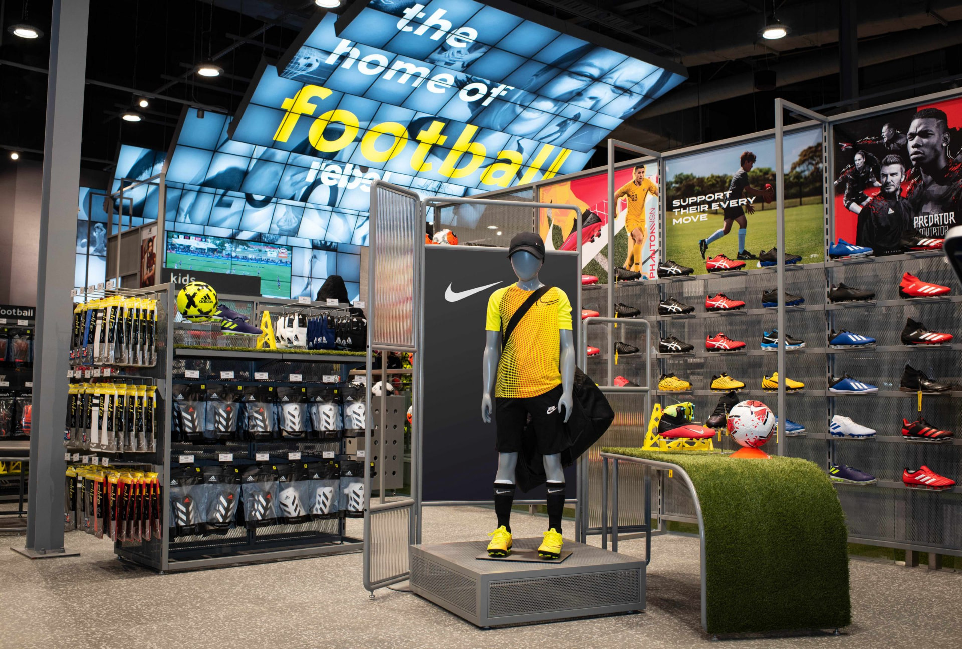 Rebel football department with footwear wall and turf display